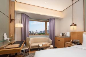 Giường trong phòng chung tại Shijiazhuang International Building Hotel +220 ảnh