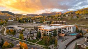 an aerial view of a building with a parking lot at Perfect Location Hot Tub Heated Pool Steam Room Gym in Mount Crested Butte