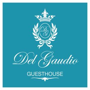 a sign for a guest house with a royal crown at Del Gaudio Guesthouse in Torre Melissa