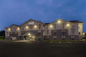a large building with a parking lot in front of it at Spark by Hilton Carlisle South in Carlisle