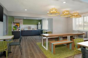 a dining room with a table and chairs at Spark by Hilton Carlisle South in Carlisle