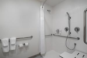 a bathroom with a shower and a toilet and towels at Spark by Hilton Carlisle South in Carlisle +55 photos