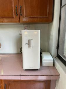 Η κουζίνα ή μικρή κουζίνα στο Sofya Homestay Kangar +1 φωτογραφίες