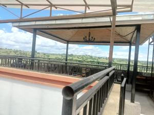 a building with a roof with a view of the countryside at Swanky Stays Studio Ngong in Nairobi