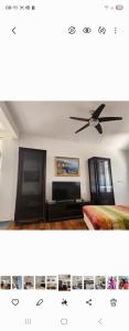 a picture of a bedroom with a ceiling fan at Ana in Bečići +5 photos