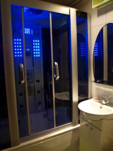 a bathroom with a shower and a sink at Rent Zhytomyr Apart in Zhytomyr