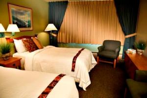 A bed or beds in a room at Westmark Sitka Hotel