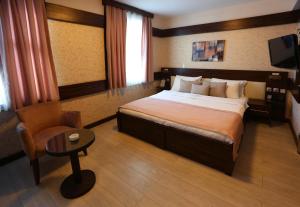 Postel nebo postele na pokoji v ubytování Wes Hotel