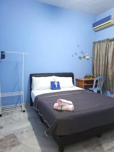 Ένα ή περισσότερα κρεβάτια σε δωμάτιο στο Acacia Guesthouse by ZamanJa