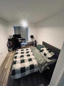 a bedroom with a bed and a desk in it at One bed flat in Sunny Southend! in Southend