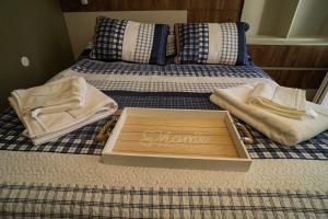 a box on top of a bed with towels at The Nest in Ruse