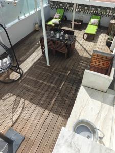 an overhead view of a deck with a table and chairs at Loft Porte Sud in Olhão