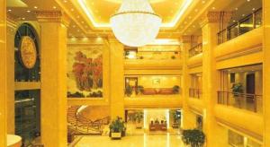 a large lobby with a chandelier in a building at Xinhai Jinjiang Hotel in Beijing +167 photos