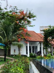 a house with a swimming pool in front of it at Terrace Phú Quốc in Phu Quoc