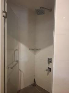 a shower with a glass door in a bathroom at Terrace Phú Quốc in Phu Quoc