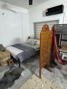 a small room with a bed and a bunk bed at Cozy Nature Homestay in Kuala Lumpur