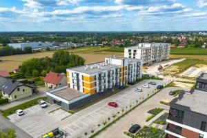 an aerial view of a building with a parking lot at Apartament Brzeziny by Stay&Rest - szybki dojazd i parking in Czechowice-Dziedzice