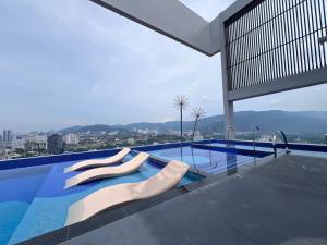 a swimming pool with a view of a city at NEW UNIT# Georgetown #Tropicana #Luxury 2BR # 5pax in George Town