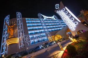 a hotel with christmas lights in front of it at Azura Deluxe Resort & Spa - Ultra All Inclusive in Avsallar