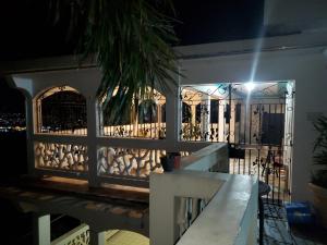 a fence in front of a gate at night at Bayview Luxury Retreat 