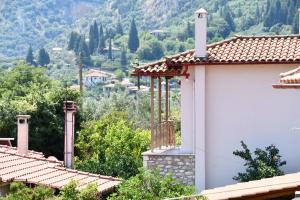 a house with a view of a mountain at Blue and Green Guesthouse in Mystras