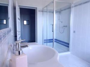 a white bathroom with a sink and a shower at West Coast in Càbras +36 photos
