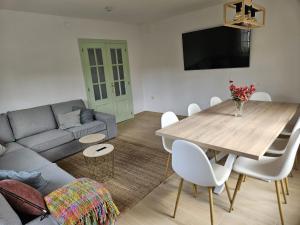 a living room with a table and a couch at El Tayo in Cudillero