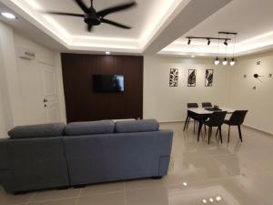 a living room with a couch and a table at Kuromi Homestay Port Dickson Ground Floor in Port Dickson