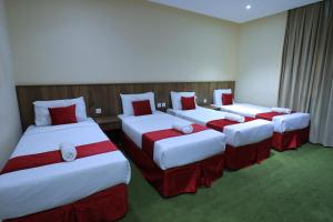 Ένα ή περισσότερα κρεβάτια σε δωμάτιο στο فندق جولدن العالمية +11 φωτογραφίες