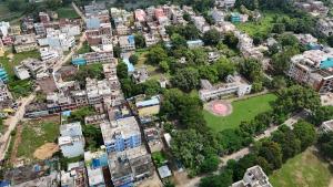 an aerial view of a city with buildings and a park at Hotel Anand LOK in Rājgīr