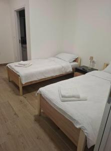 two twin beds in a room with at Burence -m in Železnik