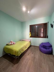 a room with a bed and two bean bags at Villa Buiza in Cunit