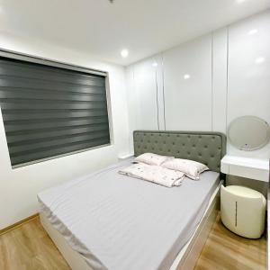 Postel nebo postele na pokoji v ubytování Căn hộ 384 Lê Thánh Tông