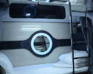 a mirror on the side of a bunk bed at O C E A N Dormitory T-2 in Mumbai