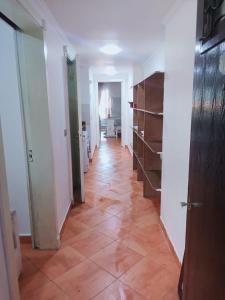 a hallway with a tile floor in a house at 321or322 the finest Porto Marina Chalets Tower 3 in El Alamein