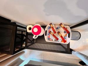a container of food sitting on a shelf in a kitchen at Glitz Hotel in Brinchang