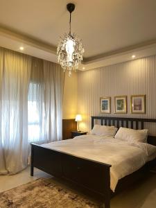 Ένα ή περισσότερα κρεβάτια σε δωμάτιο στο Ritala Royal Residence