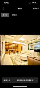 a living room with couches and a couch and a table at Taipei City Tianmu near Zhishan MRT Station in Taipei