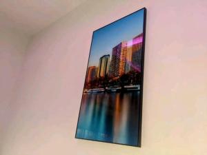 a picture of a city on the wall at Studio climé meublé a cotonou in Godomey