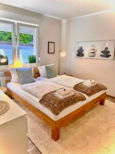 a bedroom with a large bed in a room at Reviernest in Gelsenkirchen