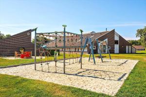 a playground in front of a brick building at C11729-Hemmet-Vester-Faelled-192-I1 in Falen