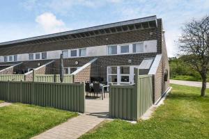 a brick house with a fence in front of it at C11726-Hemmet-Vester-Faelled-120-E1 in Falen