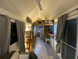 a living room and kitchen in a tiny house at Beachfront Tiny House, Koh Samui, Thailand with FREE Rowboat in Nathon Bay