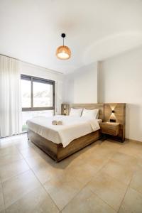 Ένα ή περισσότερα κρεβάτια σε δωμάτιο στο Al-Raha Luxury apartment