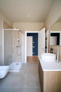a bathroom with two sinks and a shower at Premier Stay The Garden - Bernina Experience in Tirano