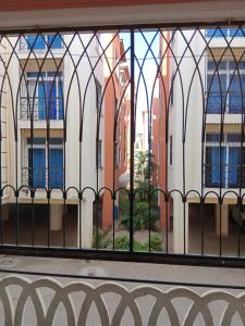 a view of a building through a window at Mtwapa Luxury Residence Block 1B in Mombasa