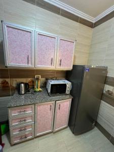 Kuchyň nebo kuchyňský kout v ubytování Alamein