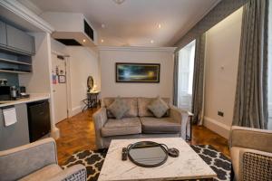 a living room with a couch and a table at King Street Aparthotel in Stirling