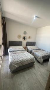 a bedroom with two beds in a room at IL Monte panoramic see view chalet in Ain Sokhna