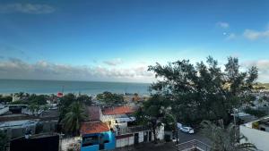 a view of a city with the ocean in the background at Flat Paradise in Natal